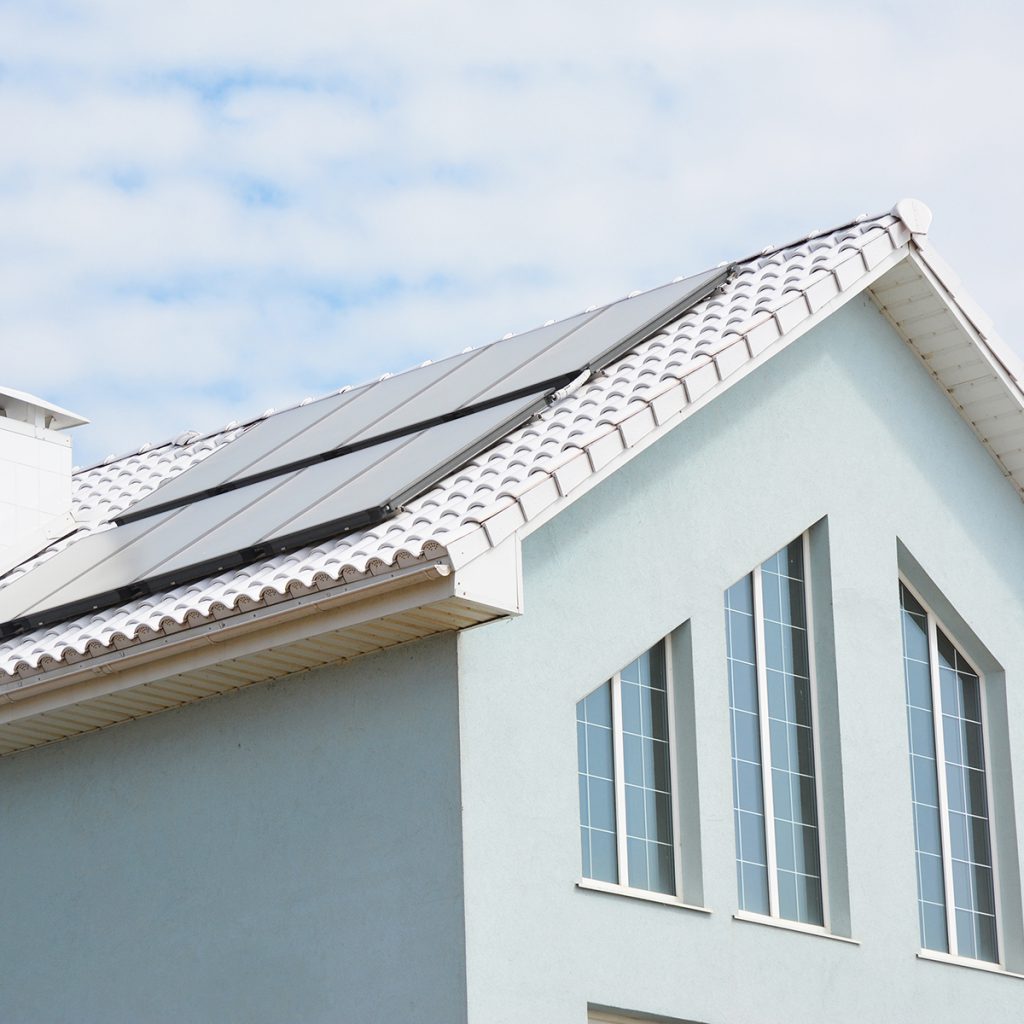 modern house with solar panels on roof