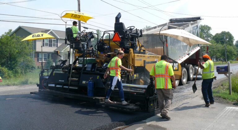 Occhino Corp team paving asphalt road