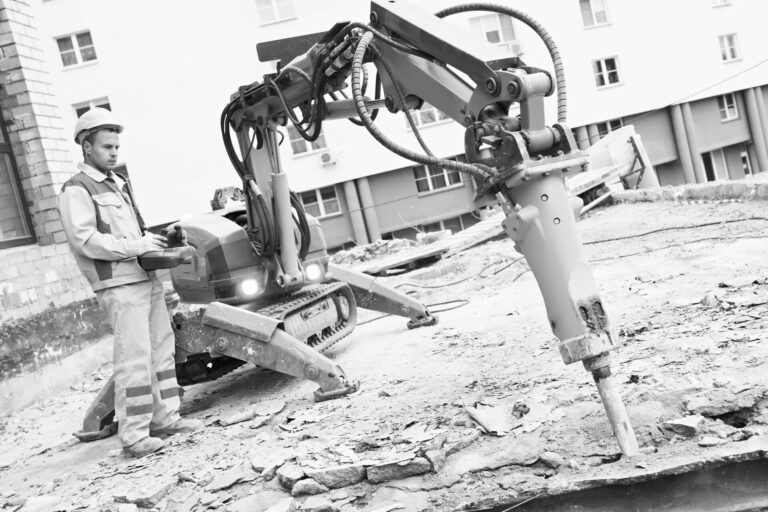 builder using automated construction equipment on job site