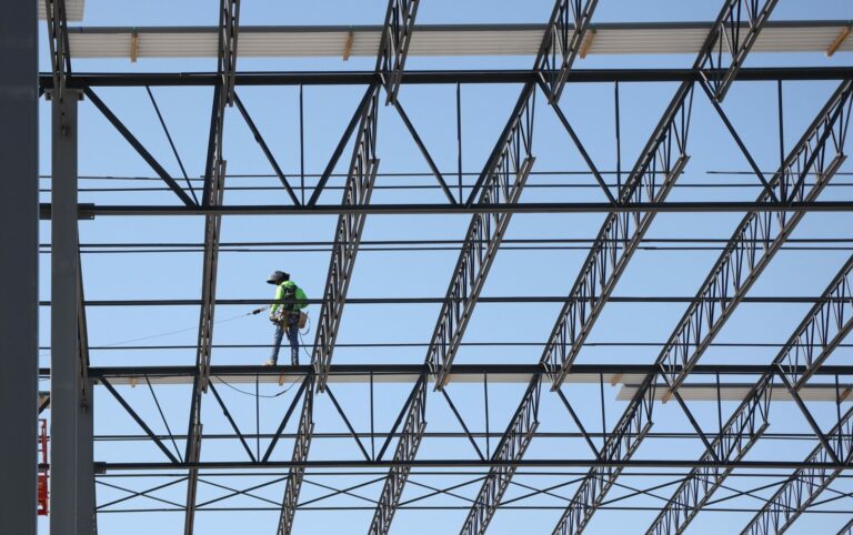 conewago worker on metal structure beams